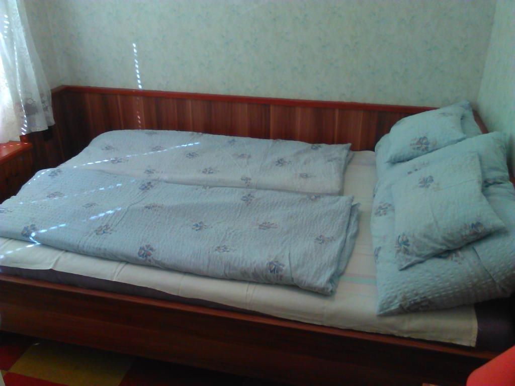 Łóżko lub łóżka w pokoju w obiekcie Family Home Apartment