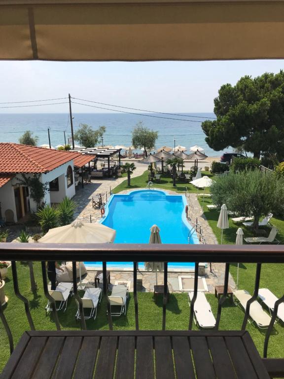 a view from the balcony of a resort with a swimming pool at HOTEL BARA in Neos Marmaras