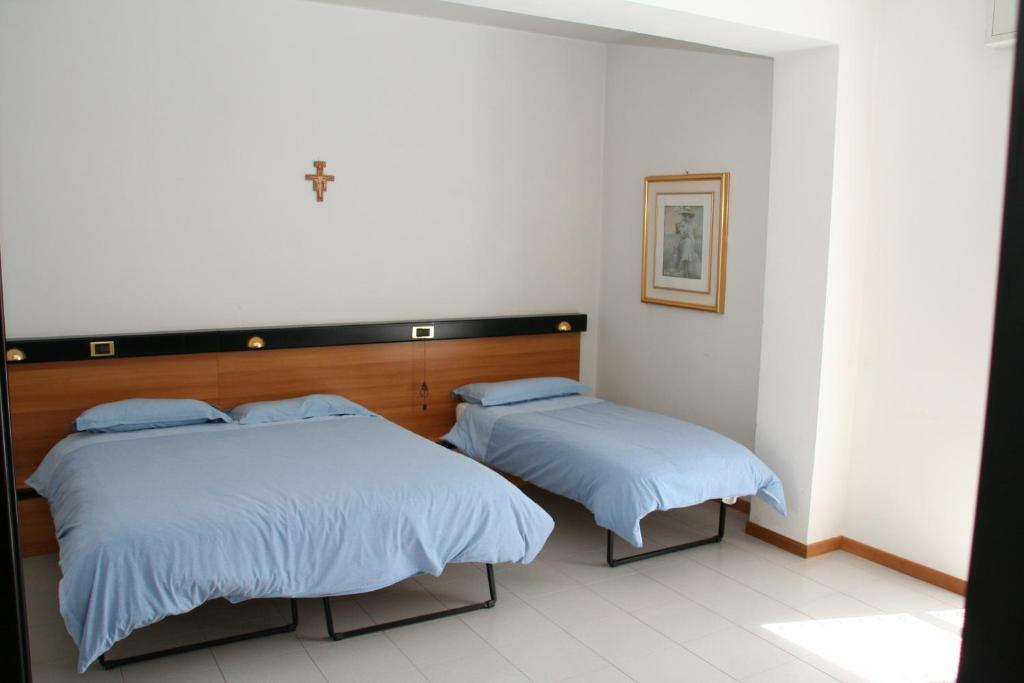 Postel nebo postele na pokoji v ubytování Albergo Sala