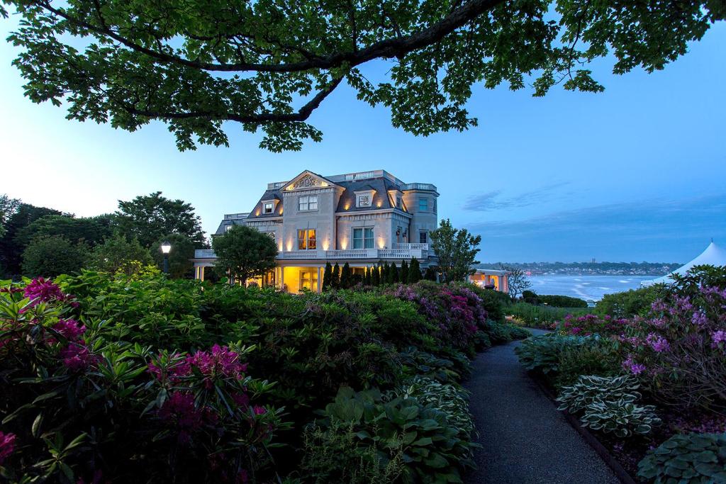 a house on a hill with a garden at The Chanler at Cliff Walk in Newport
