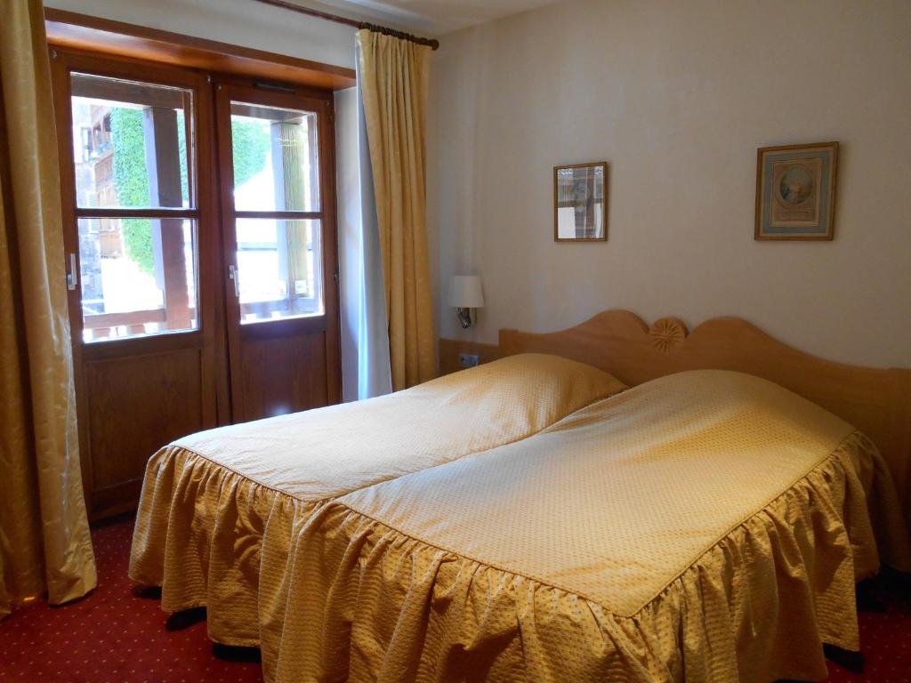 Postel nebo postele na pokoji v ubytování Hotel Saint-Martin