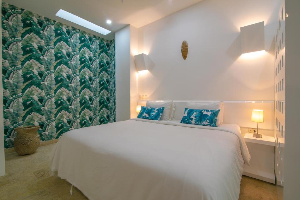 Postel nebo postele na pokoji v ubytování El Cactus Luxury Apartments in Historic Center