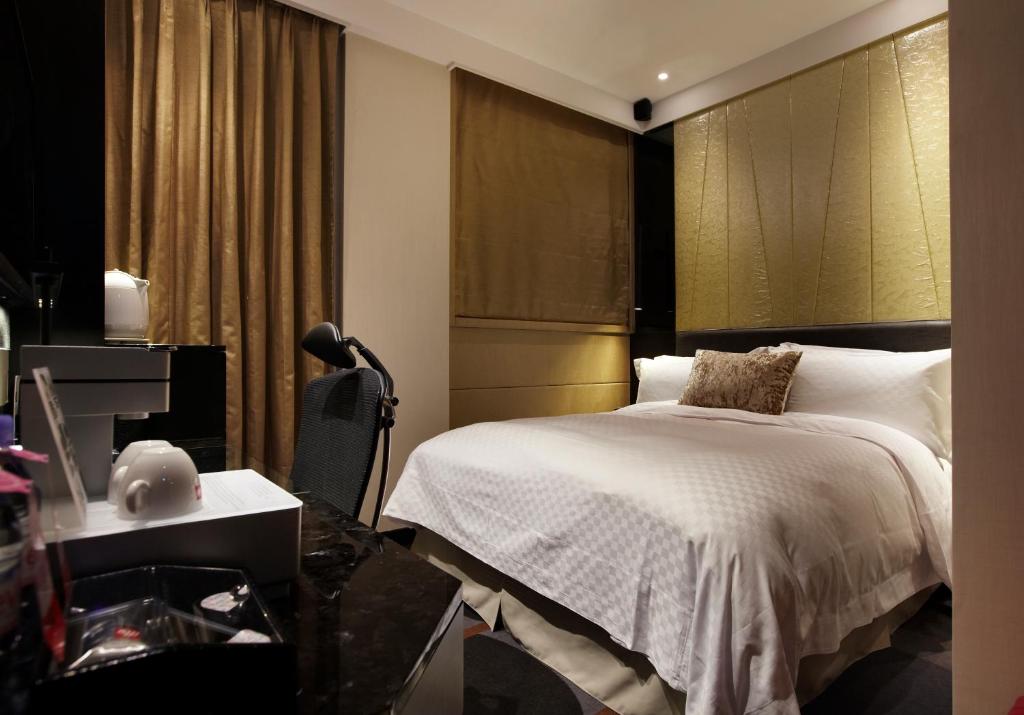 Postel nebo postele na pokoji v ubytování The Tango Hotel Taipei ChangAn