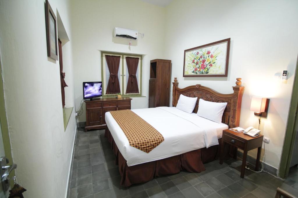 Krevet ili kreveti u jedinici u okviru objekta The Kresna Hotel