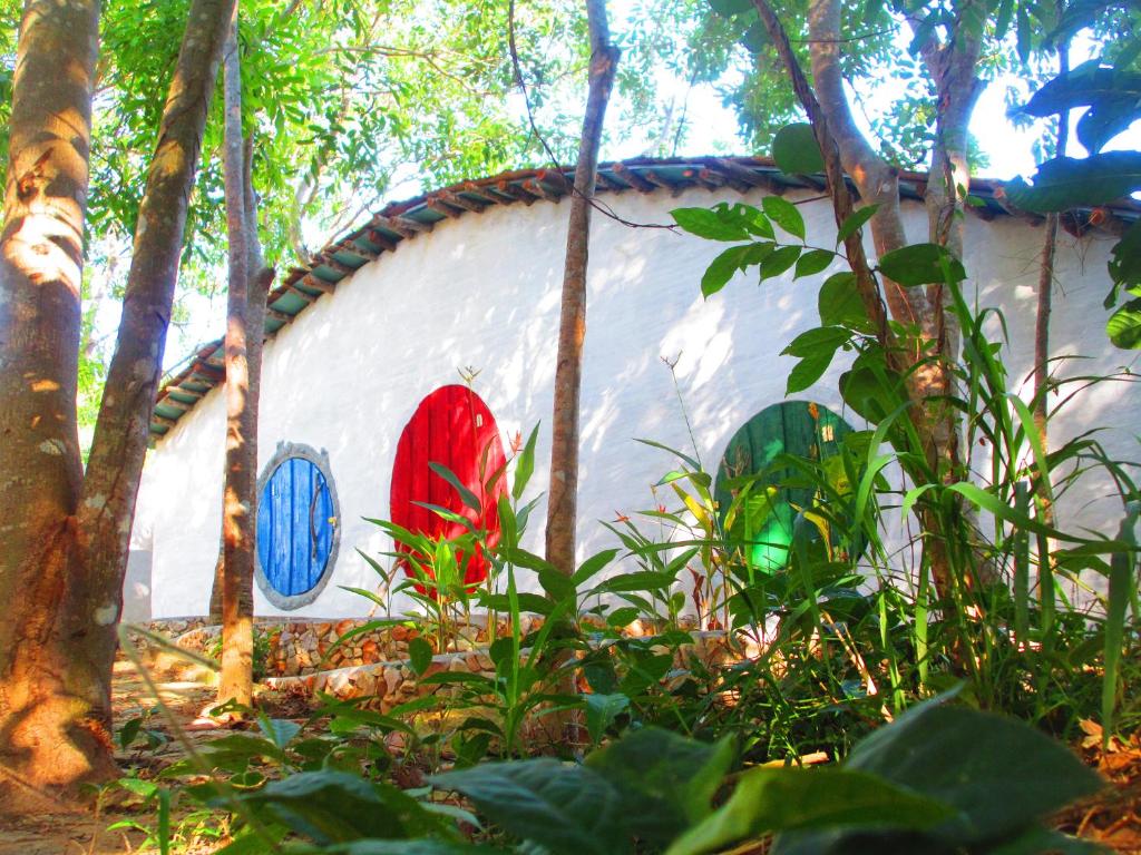 a building with paintings on the side of it at Phu Nam House - Resort in Phú Quốc