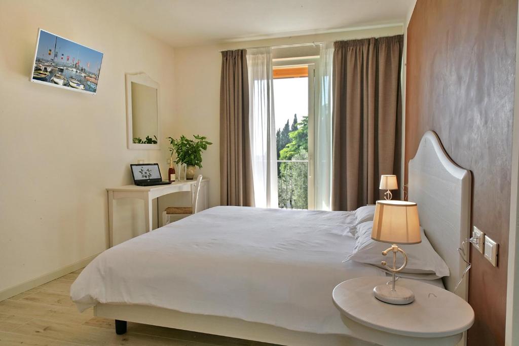 Postel nebo postele na pokoji v ubytování Relais Colle San Giorgio