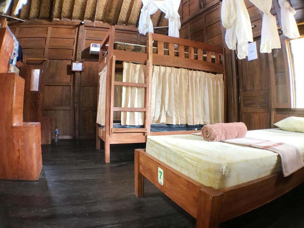 Postel nebo postele na pokoji v ubytování Green Paddy Hostel & Villa
