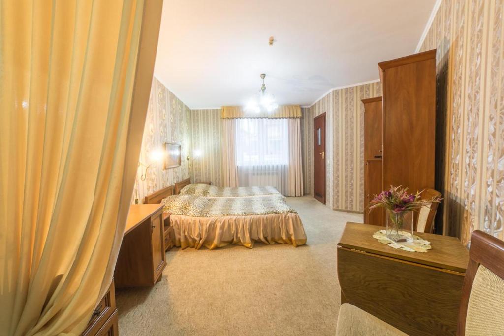 Postel nebo postele na pokoji v ubytování Hotel Premyer