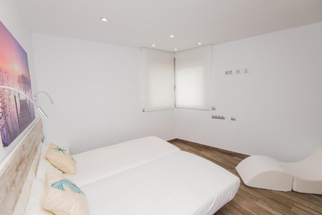 A bed or beds in a room at Villa Can Nieves