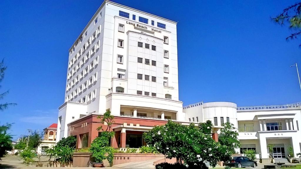 a large white building with aventh floor at Long Beach Hotel in Tuy Hoa