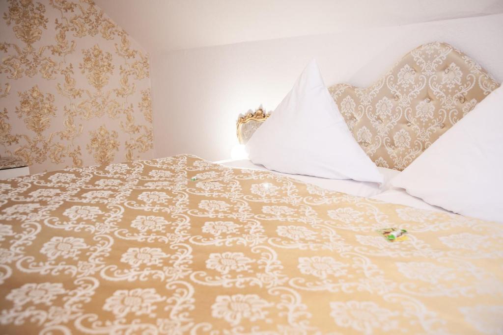 Postel nebo postele na pokoji v ubytování Hotel Wulff