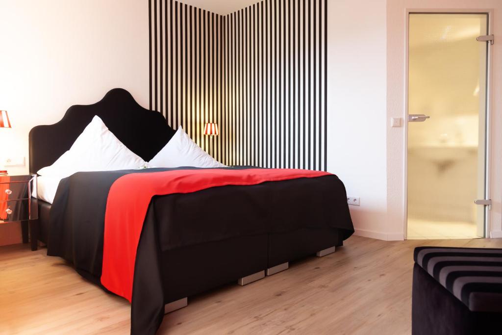 Postel nebo postele na pokoji v ubytování Hotel Wulff
