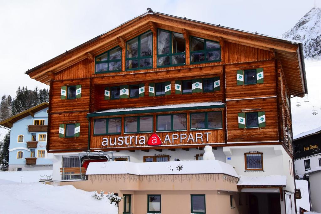 a building with a sign that reads australian apartment at AUSTRIA APPART in Obertauern