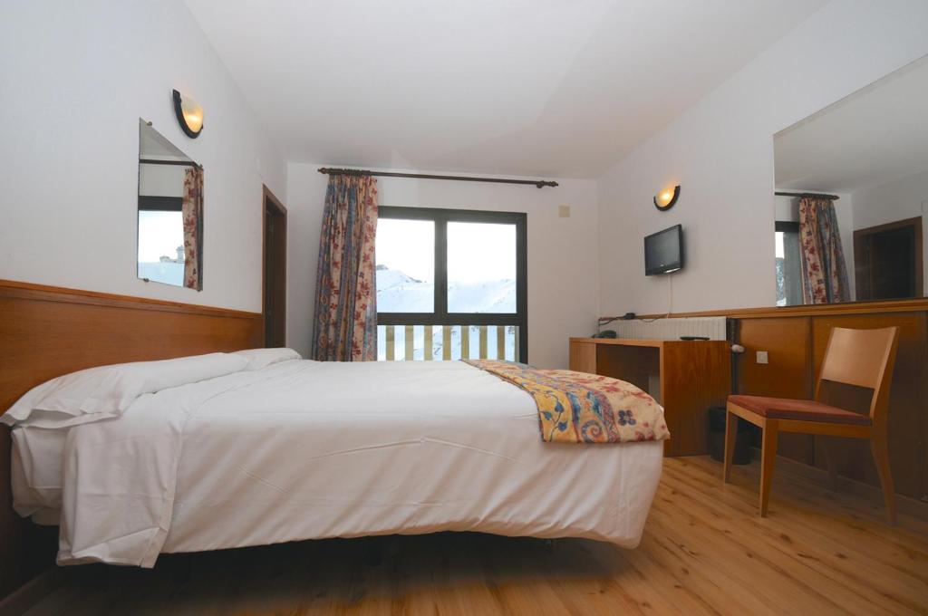 Postel nebo postele na pokoji v ubytování Pic Maià Mountain Hotel