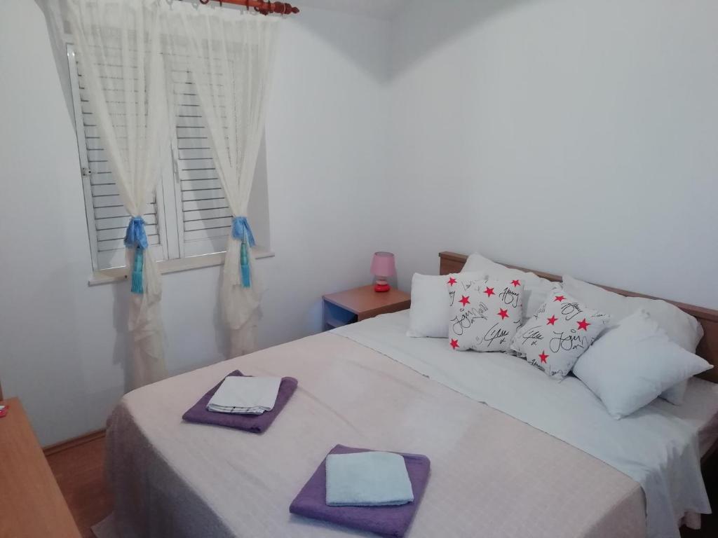 Posteľ alebo postele v izbe v ubytovaní Apartman Radic