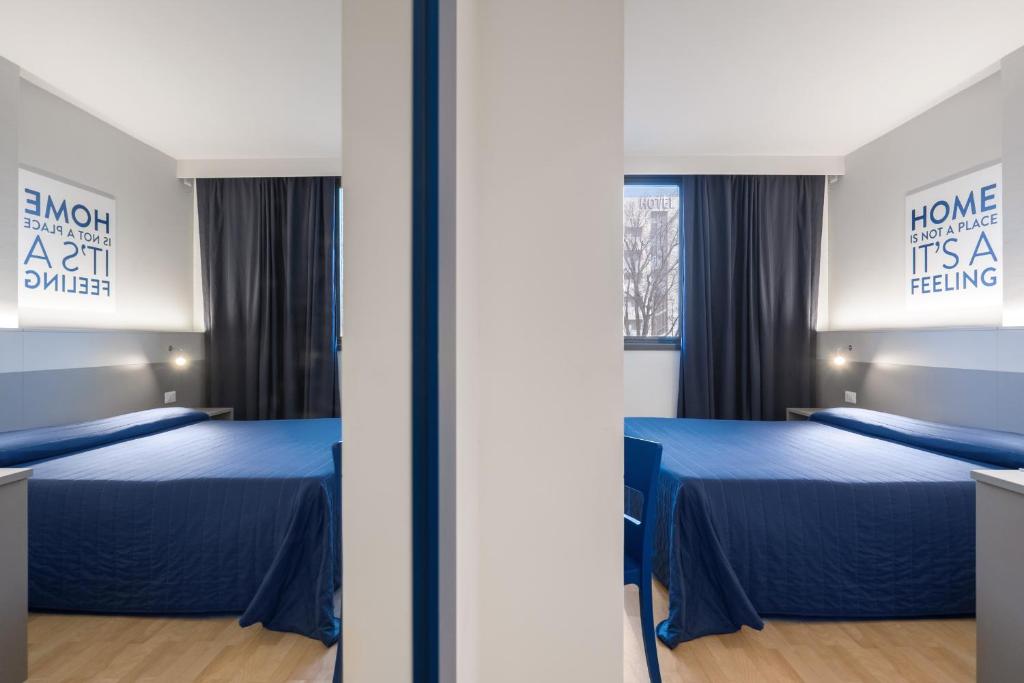 Postel nebo postele na pokoji v ubytování Hotel Martini