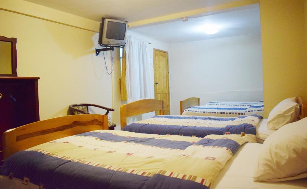 Postel nebo postele na pokoji v ubytování Meraki Hotel