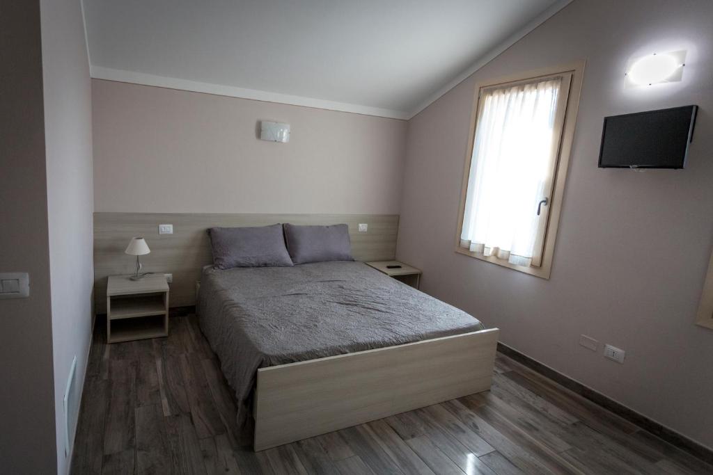 Posteľ alebo postele v izbe v ubytovaní Agriturismo Corte Casello