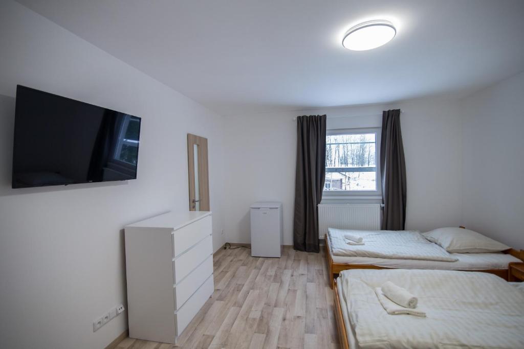 Łóżko lub łóżka w pokoju w obiekcie Apartment Šarka