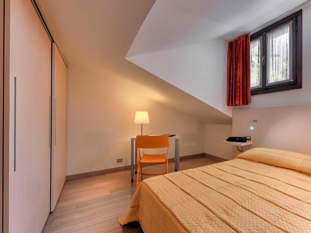 Postel nebo postele na pokoji v ubytování Hotel Alaska