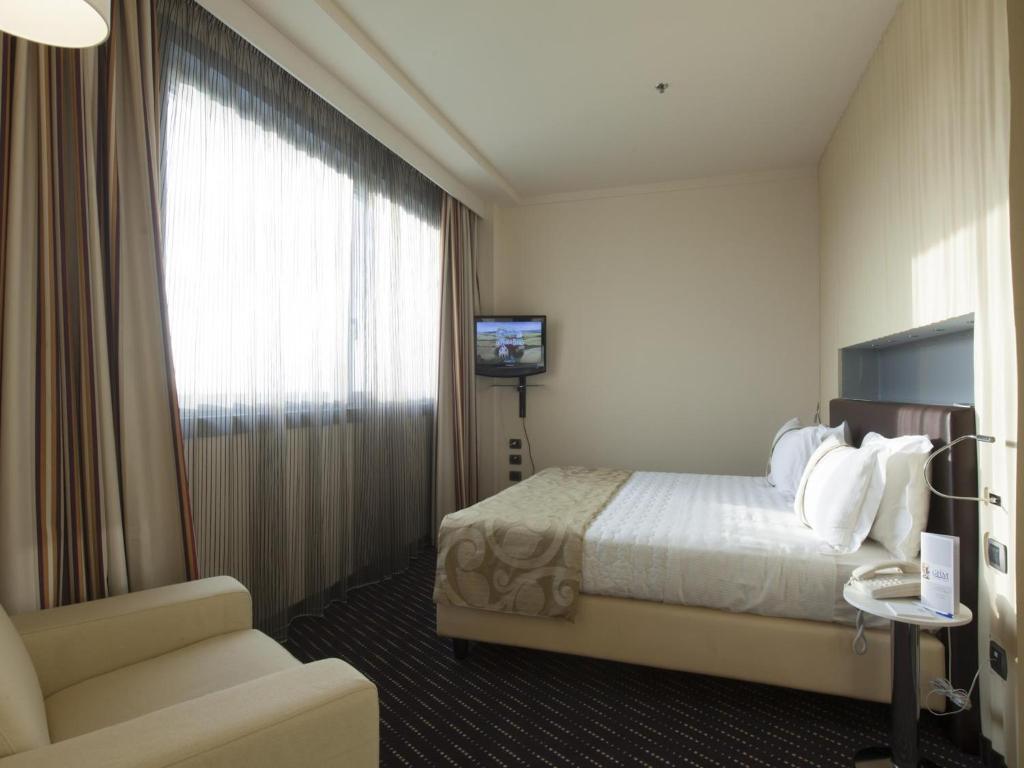 Posteľ alebo postele v izbe v ubytovaní Grand Hotel Mattei