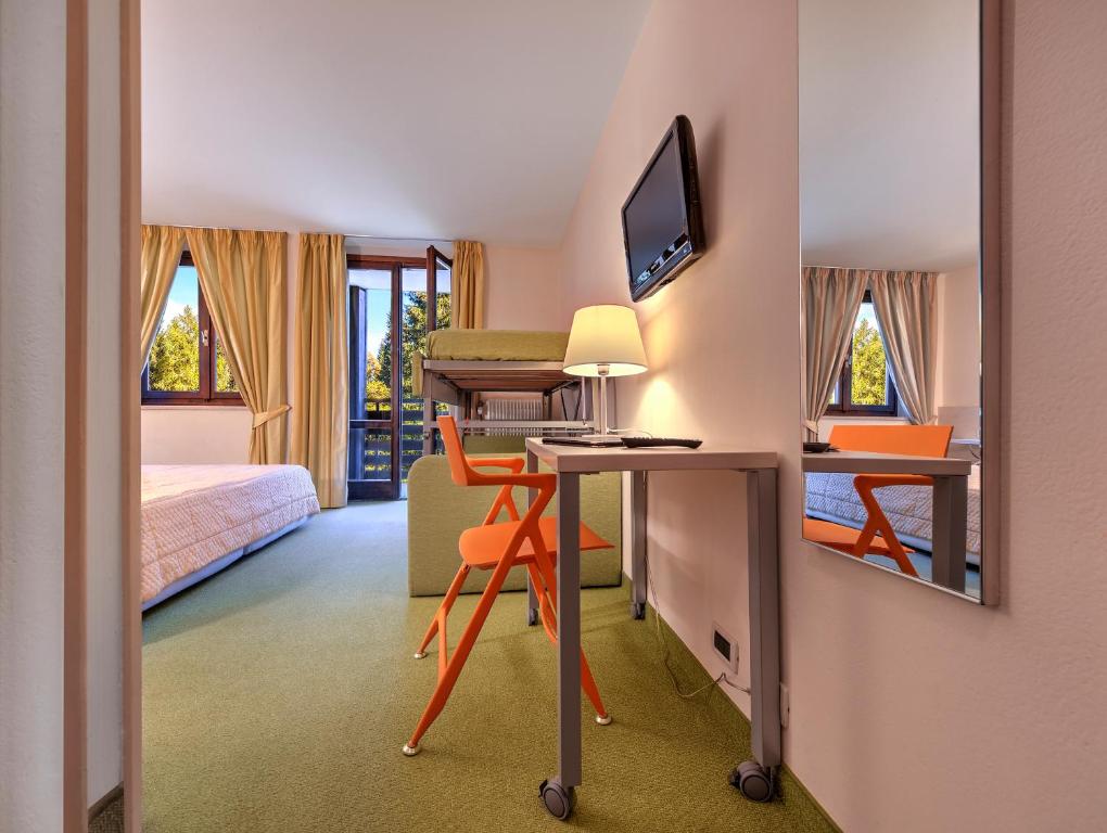 Postel nebo postele na pokoji v ubytování Hotel Alaska