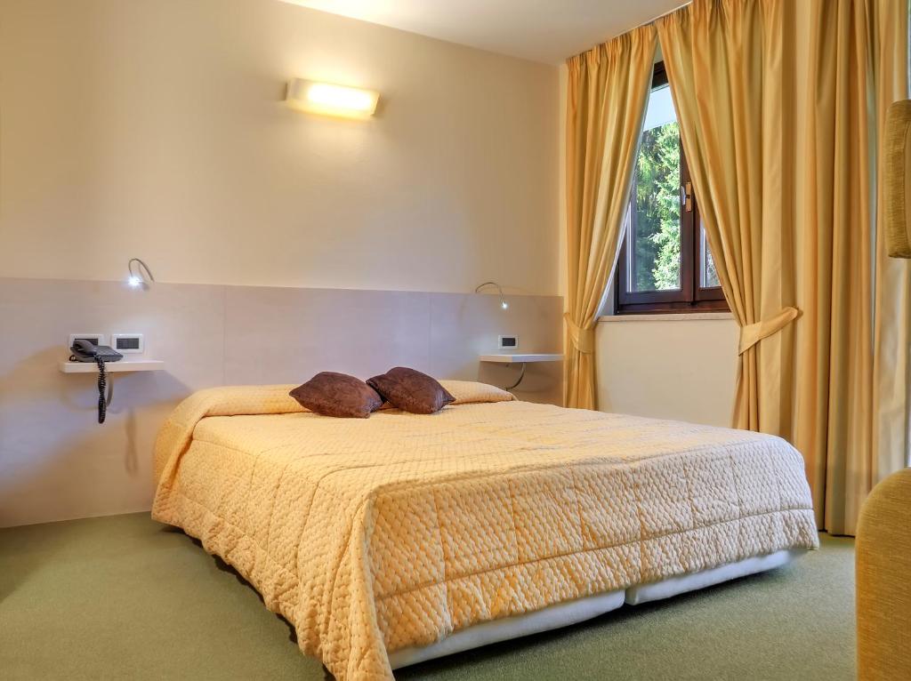Postel nebo postele na pokoji v ubytování Hotel Alaska