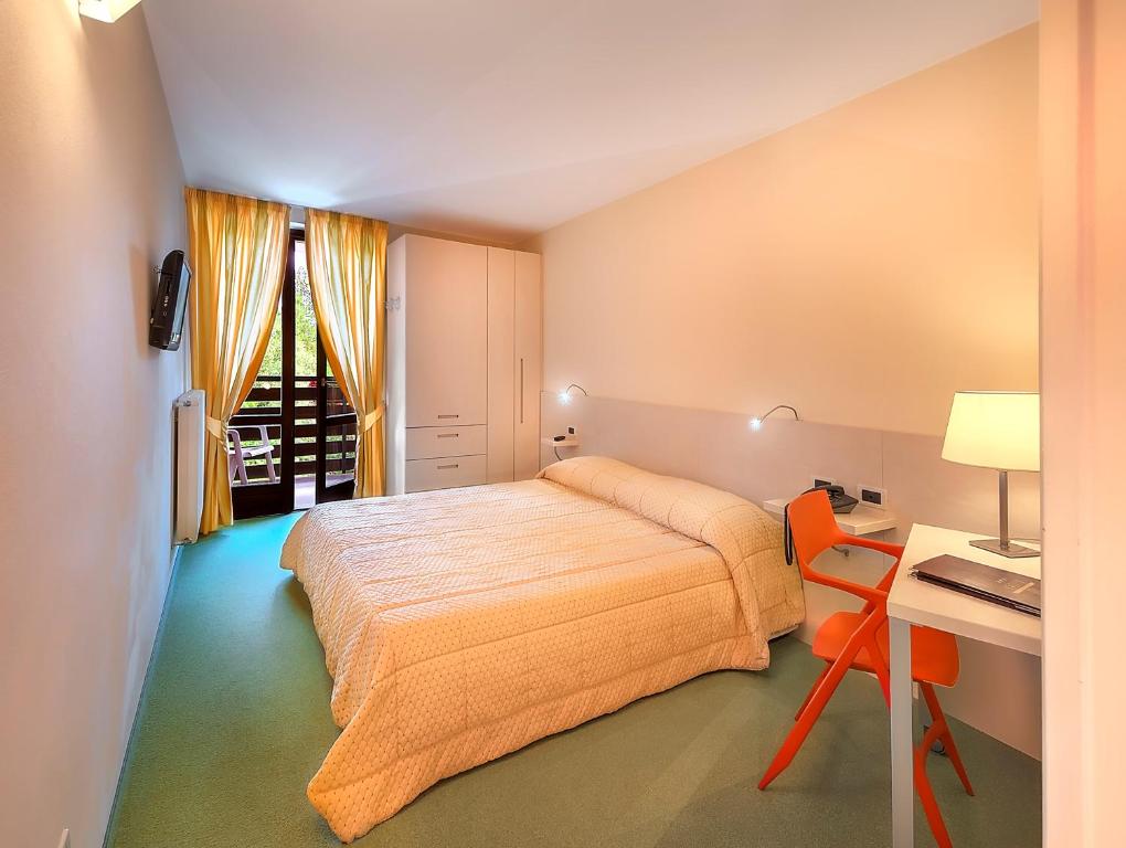 Postel nebo postele na pokoji v ubytování Hotel Alaska