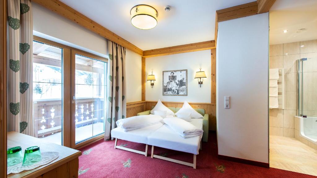 Posteľ alebo postele v izbe v ubytovaní Alpenresort Fluchthorn