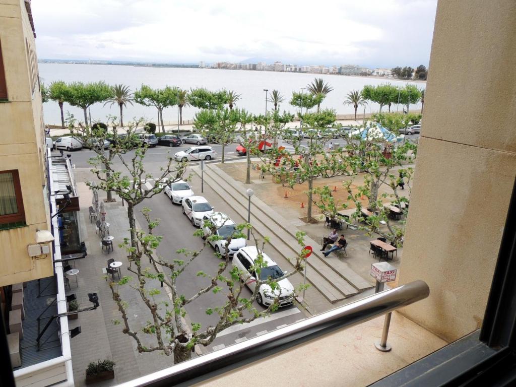 a view from a window of a parking lot at Llevant 3 1 Centro Roses - Barneda Premium in Roses