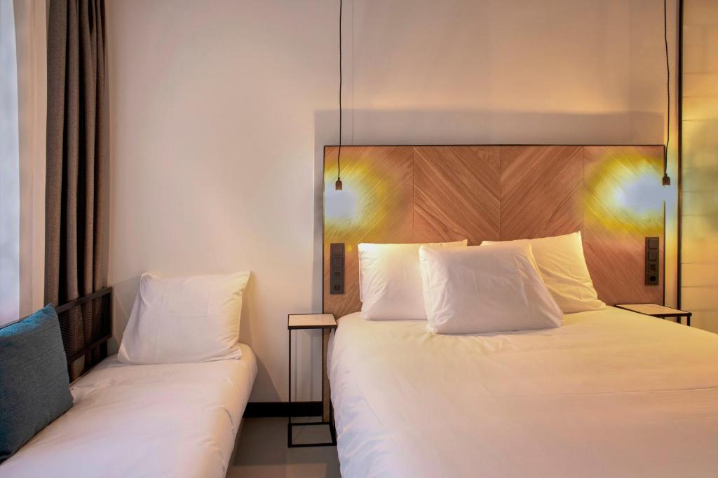 Postel nebo postele na pokoji v ubytování Hotel the Match
