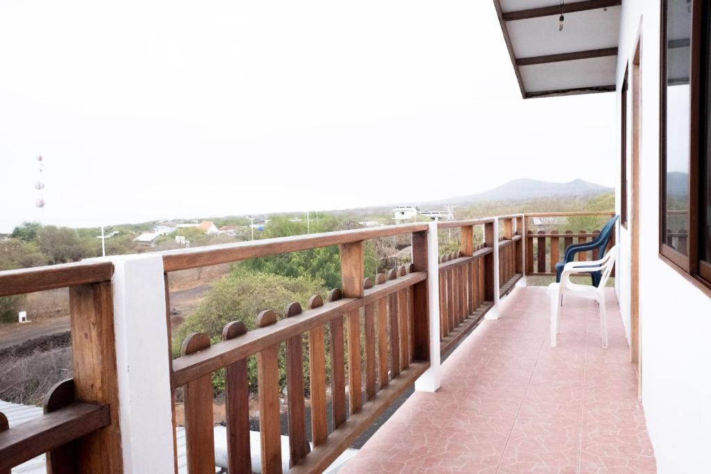 a balcony with a view of the mountains at Hostal Santa Maria in Floreana