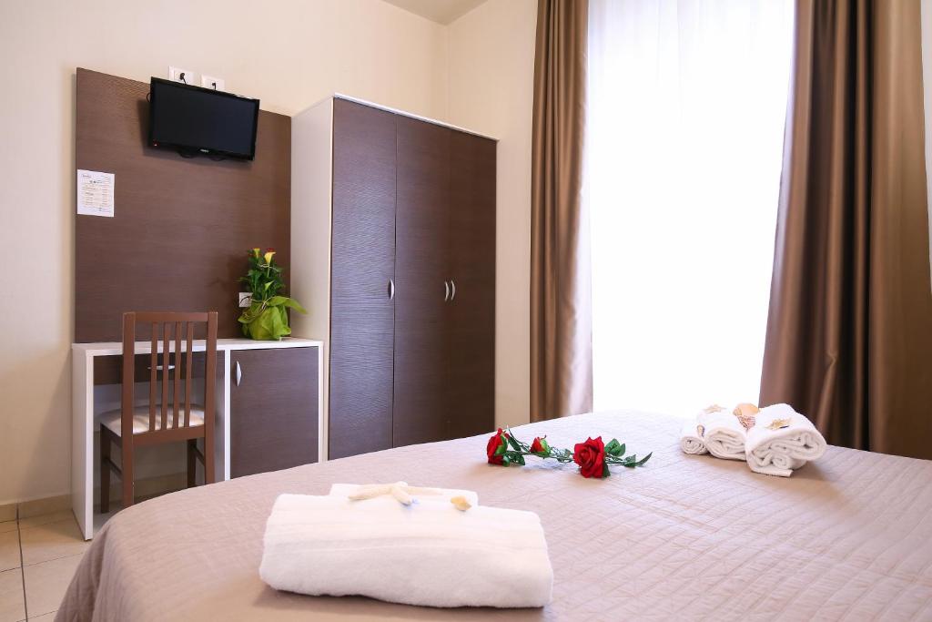Postel nebo postele na pokoji v ubytování Hotel Bergamo