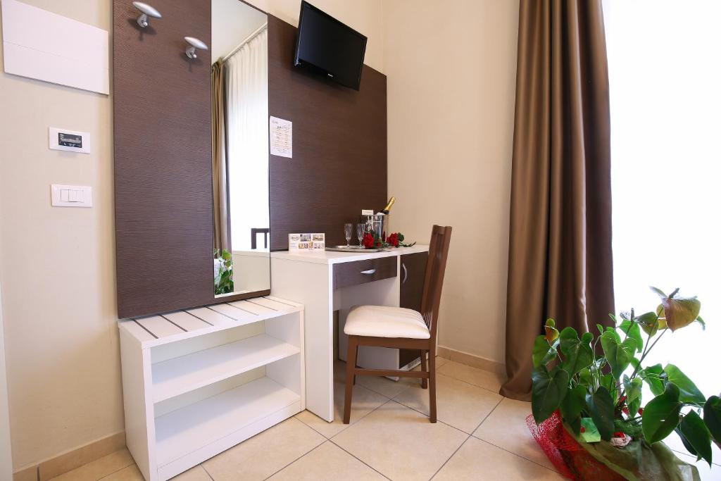 TV a/nebo společenská místnost v ubytování Hotel Bergamo