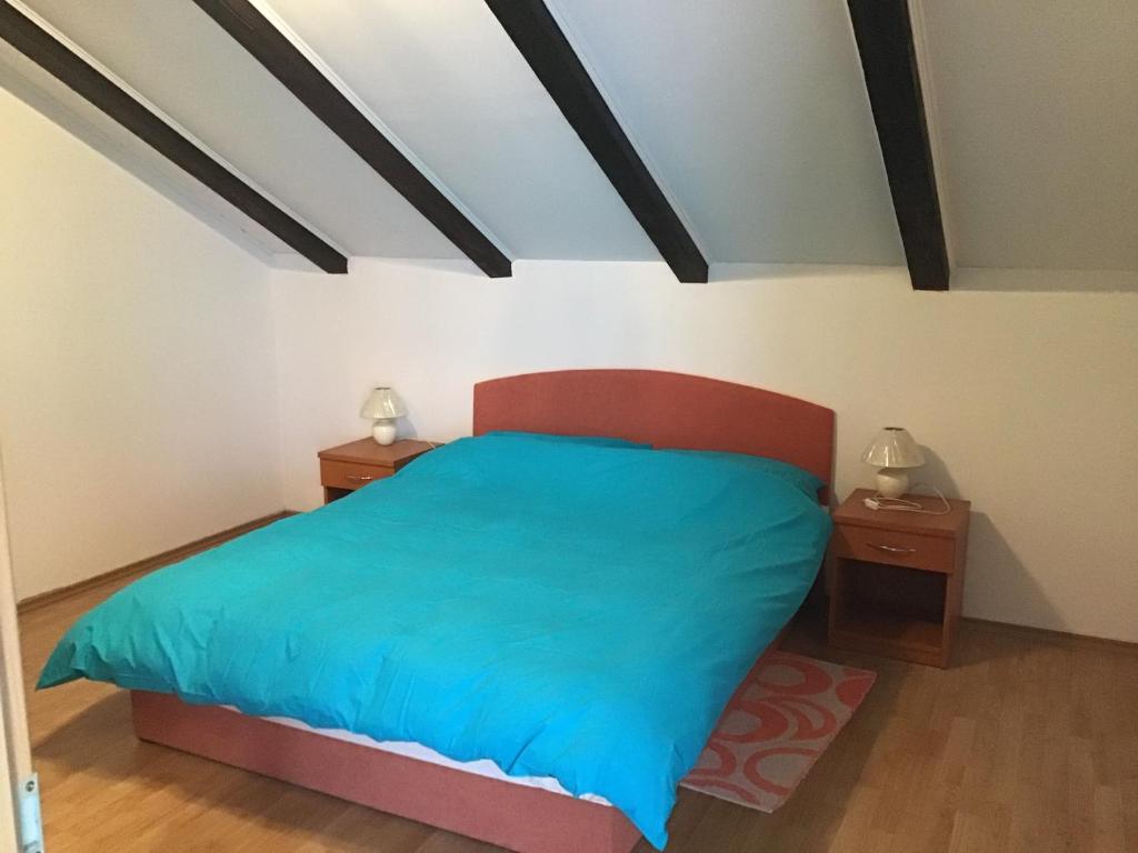 Posteľ alebo postele v izbe v ubytovaní Apartman Carina