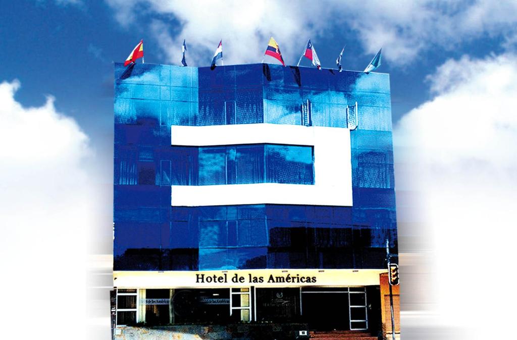 a building with a sign that reads hospital be its antioch at Hotel de las Américas - Ambato in Ambato