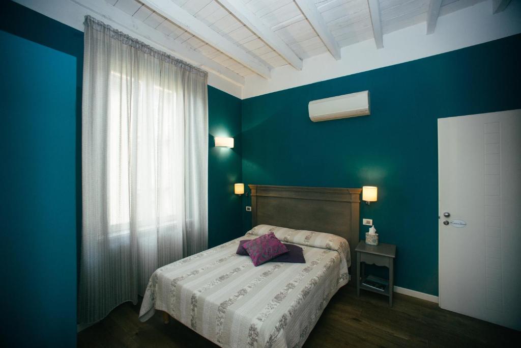 Posteľ alebo postele v izbe v ubytovaní Locanda Cece e Simo