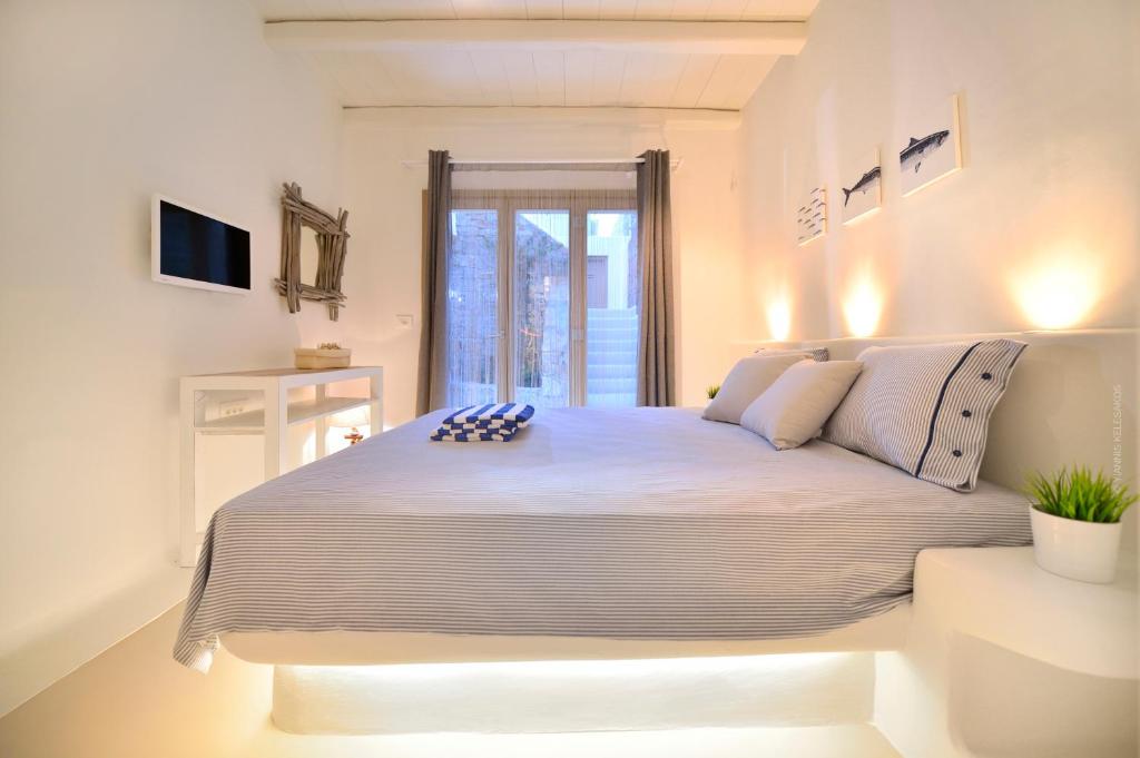 Łóżko lub łóżka w pokoju w obiekcie Villa Kimothoe by Thalassa Residence Mykonos