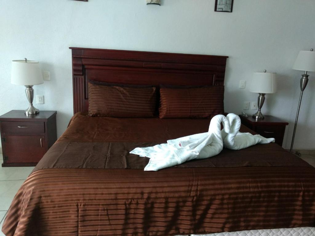 Postel nebo postele na pokoji v ubytování HOTEL JD TEPOZTLÁN