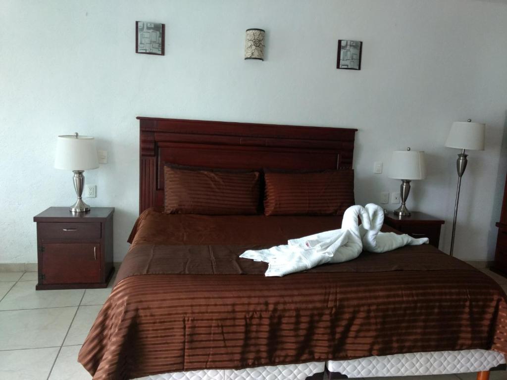 Postel nebo postele na pokoji v ubytování HOTEL JD TEPOZTLÁN