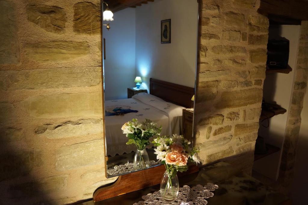 Postel nebo postele na pokoji v ubytování Frigino Agriturismo
