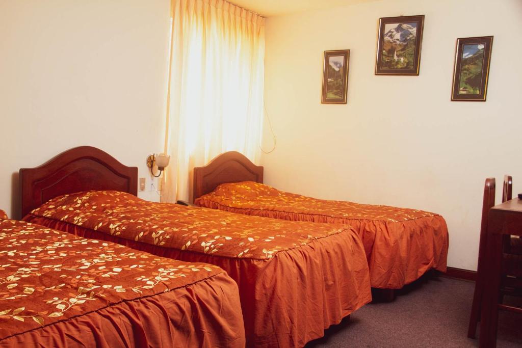 Ένα ή περισσότερα κρεβάτια σε δωμάτιο στο Hotel Internacional