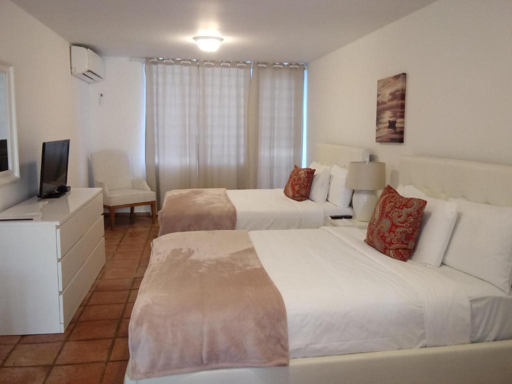 Postel nebo postele na pokoji v ubytování Hosteria del Mar