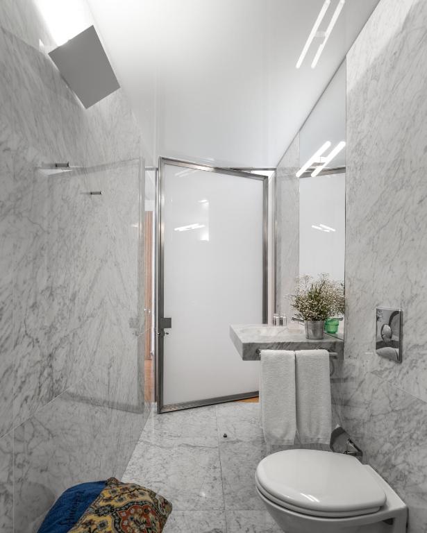 a bathroom with a shower and a toilet in it at Flattered to be in Porto in Porto