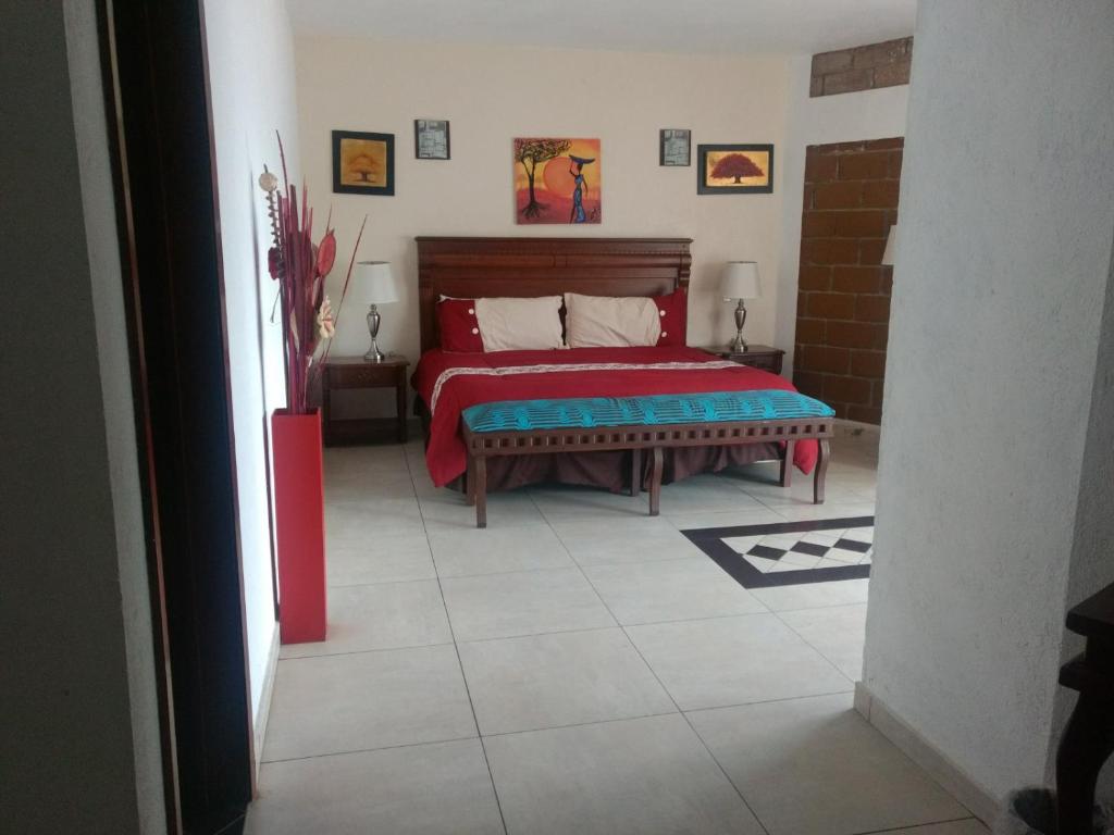 Postel nebo postele na pokoji v ubytování HOTEL JD TEPOZTLÁN