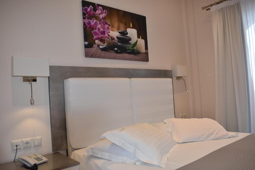 Postel nebo postele na pokoji v ubytování Marinis Boutique Rooms