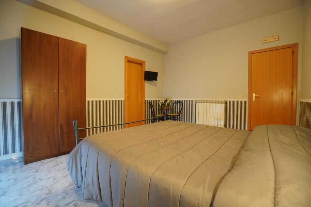 Postel nebo postele na pokoji v ubytování Hotel Stefany