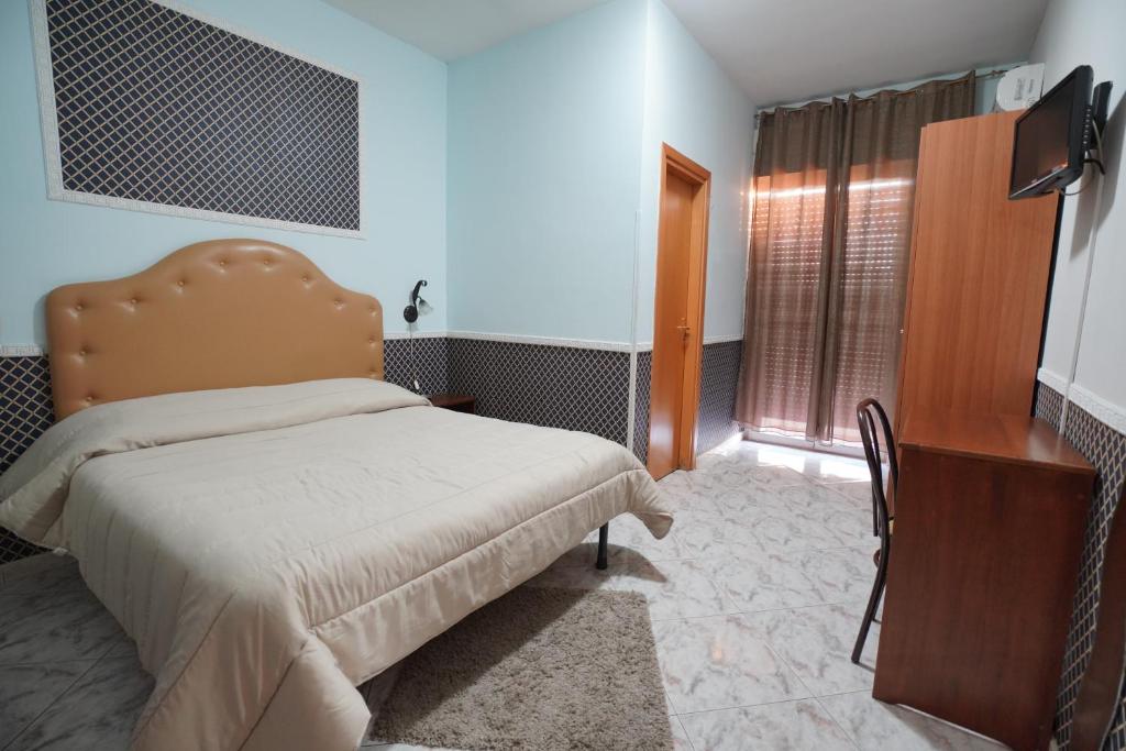 Postel nebo postele na pokoji v ubytování Hotel Stefany