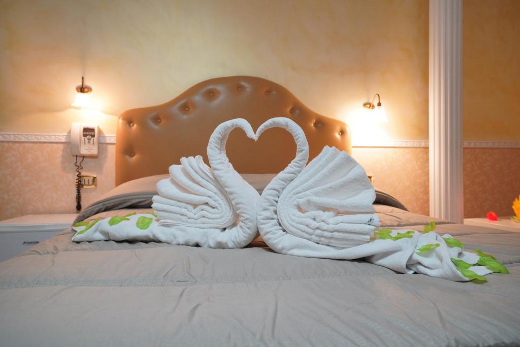 Postel nebo postele na pokoji v ubytování Hotel Stefany