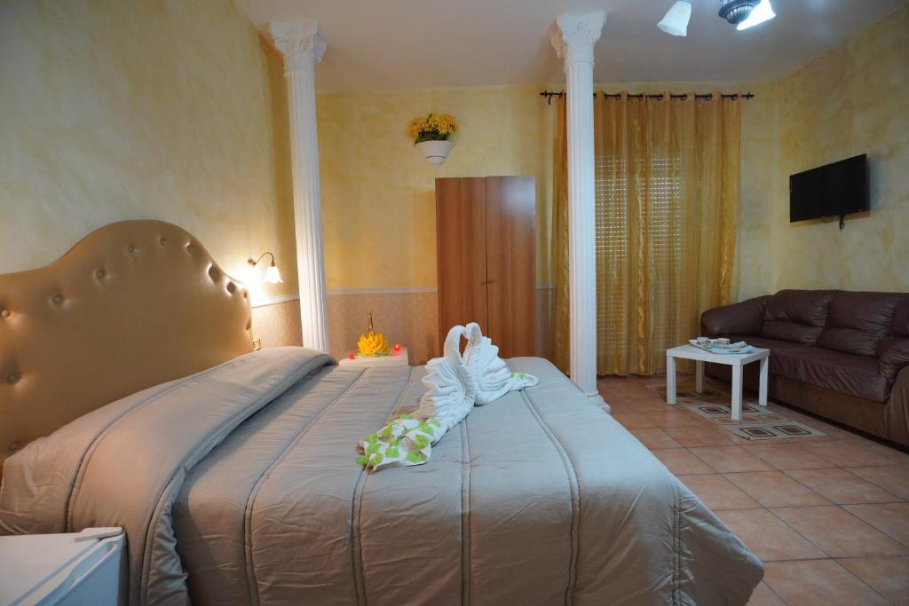 Postel nebo postele na pokoji v ubytování Hotel Stefany